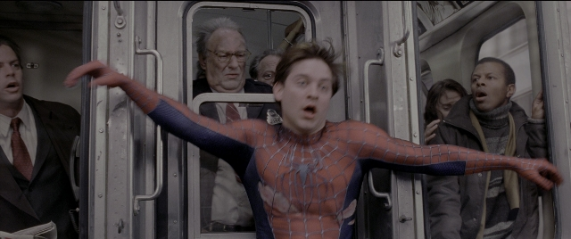Wide shot frame from Spider-Man 2 — dialogue, suit, face