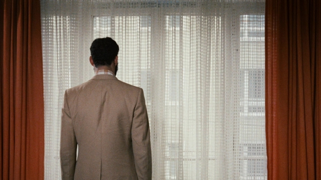 Wide shot frame from Angst essen Seele auf — standing, room, bed