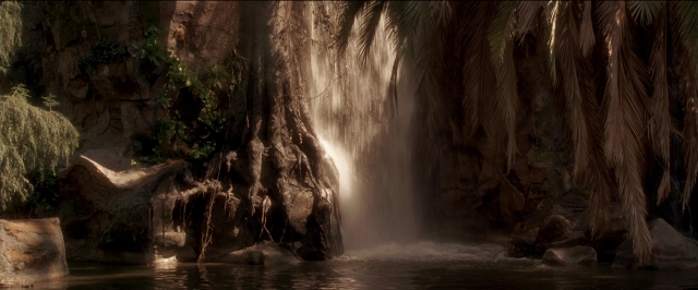 Wide shot frame from Anaconda — water, fountain