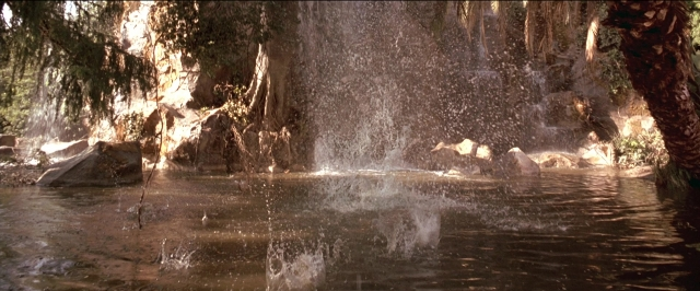 Wide shot frame from Anaconda — water, fountain