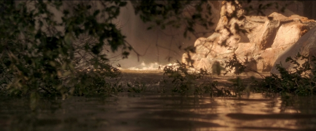 Wide shot frame from Anaconda — water, fountain