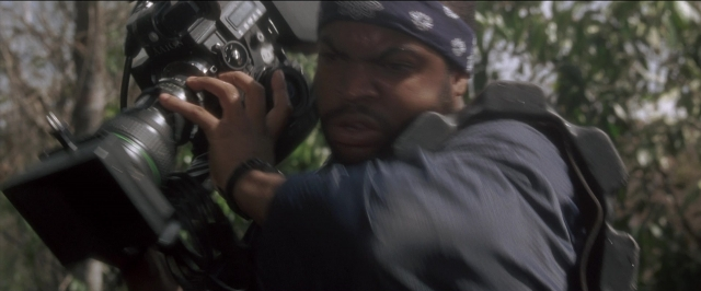 Frame from Anaconda — shirt, face, camera