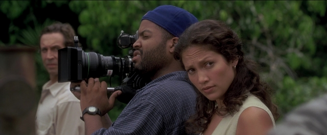 Wide shot frame from Anaconda — standing, shirt, beard