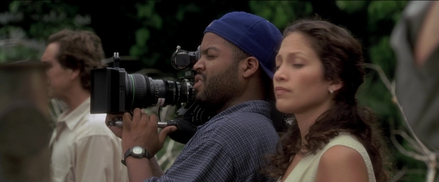 Frame from Anaconda — standing, shirt, face
