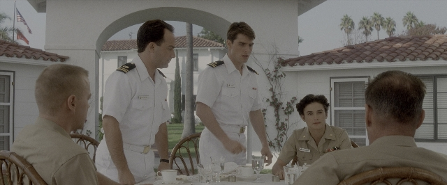 Medium shot frame from A Few Good Men — sitting, standing, table