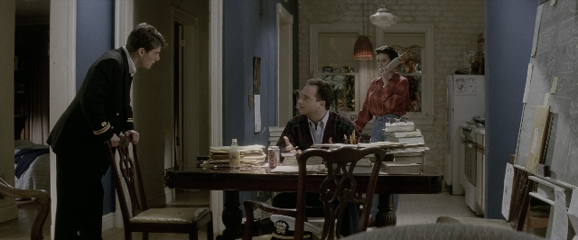 Wide shot frame from A Few Good Men — sitting, standing, room