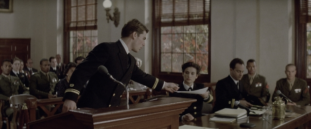 Wide shot frame from A Few Good Men — sitting, standing, room