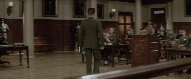 Wide shot frame from A Few Good Men — sitting, standing, room