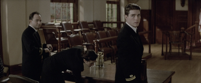Wide shot frame from A Few Good Men — standing, room, table