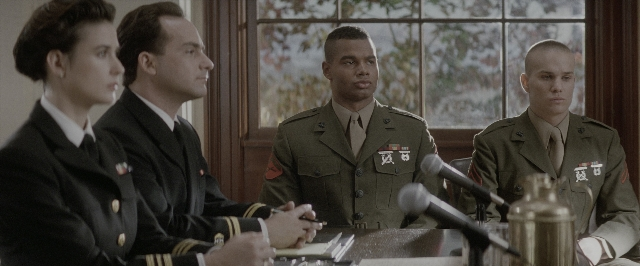 Wide shot frame from A Few Good Men — sitting, standing, room