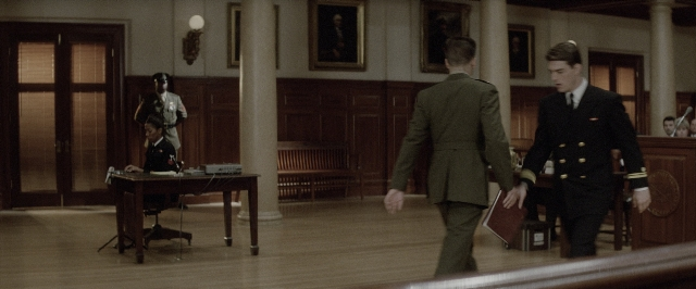 Wide shot frame from A Few Good Men — sitting, walking, room
