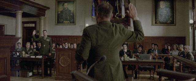 Medium shot frame from A Few Good Men — sitting, standing, room