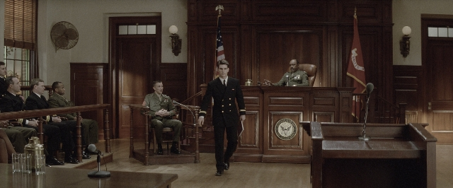 Wide shot frame from A Few Good Men — sitting, standing, room
