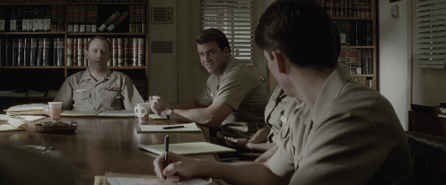 Wide shot frame from A Few Good Men — sitting, book, room