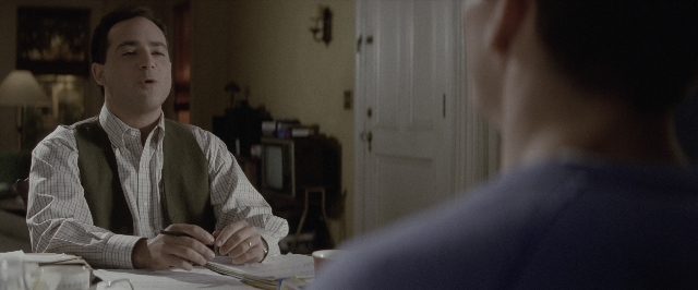 Wide shot frame from A Few Good Men — sitting, room, table