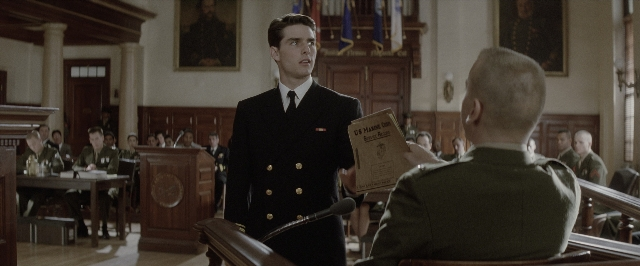 Wide shot frame from A Few Good Men — sitting, standing, table