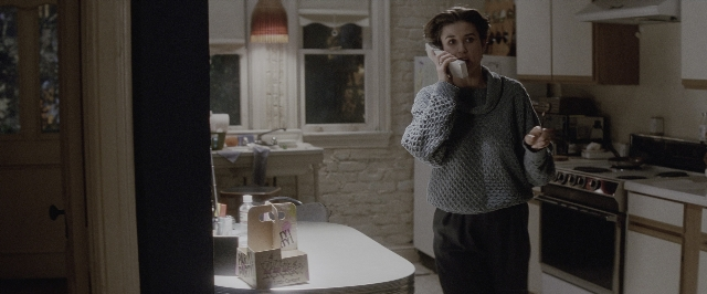 Wide shot frame from A Few Good Men — standing, table, phone