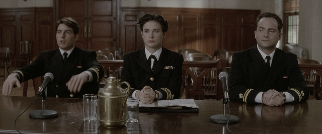 Wide shot frame from A Few Good Men — sitting, table, suit