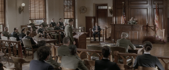 Wide shot frame from A Few Good Men — sitting, standing, room