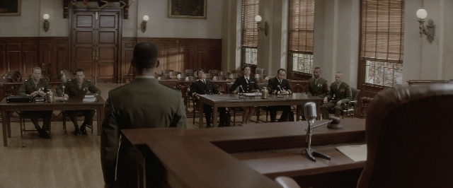 Wide shot frame from A Few Good Men — sitting, standing, room