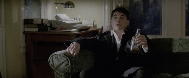 Wide shot frame from A Few Good Men — sitting, book, room