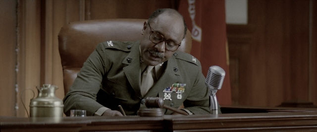 Wide shot frame from A Few Good Men — sitting, table, uniform