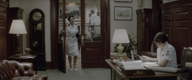 Wide shot frame from A Few Good Men — standing, room, table