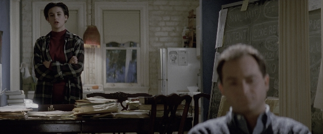 Wide shot frame from A Few Good Men — standing, room, table