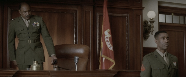 Wide shot frame from A Few Good Men — standing, uniform, suit