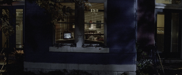 Medium shot frame from A Few Good Men — table, door, night