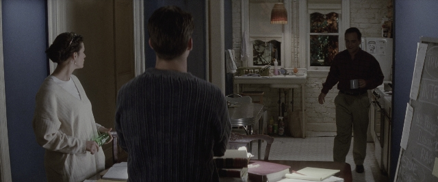 Wide shot frame from A Few Good Men — standing, room, table