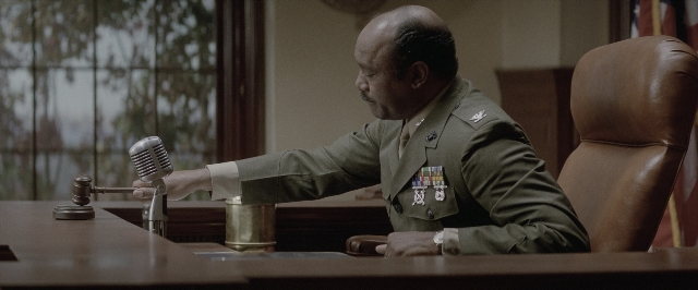 Wide shot frame from A Few Good Men — sitting, table, uniform