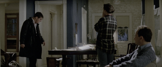 Wide shot frame from A Few Good Men — sitting, standing, room