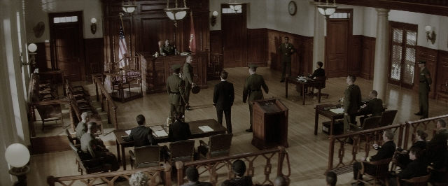 Wide shot frame from A Few Good Men — sitting, standing, room