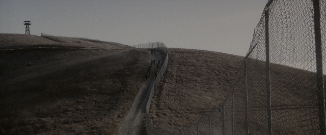 Wide shot frame from A Few Good Men — walking, street, tower
