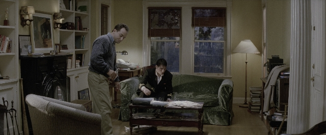 Wide shot frame from A Few Good Men — sitting, book, standing