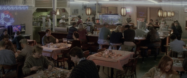 Wide shot frame from A Few Good Men — sitting, standing, table
