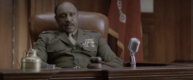 Wide shot frame from A Few Good Men — sitting, table, uniform