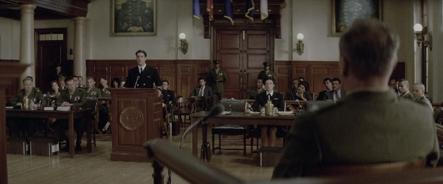 Wide shot frame from A Few Good Men — sitting, standing, room