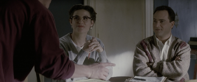 Wide shot frame from A Few Good Men — sitting, room, table