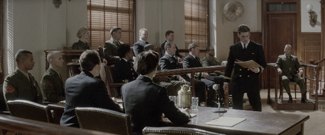 Wide shot frame from A Few Good Men — sitting, standing, room