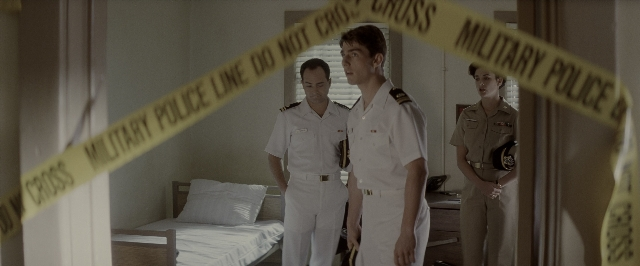 Wide shot frame from A Few Good Men — standing, room, dialogue
