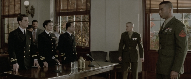 Wide shot frame from A Few Good Men — standing, room, table