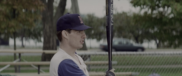 Wide shot frame from A Few Good Men — standing, hat, car