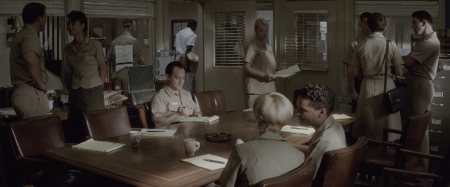 Wide shot frame from A Few Good Men — sitting, standing, room