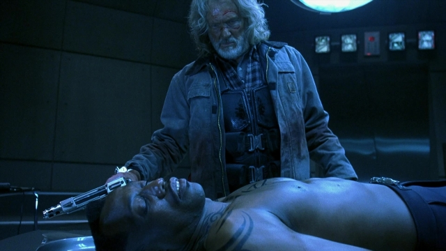 Frame from Blade II — room, bed, hand