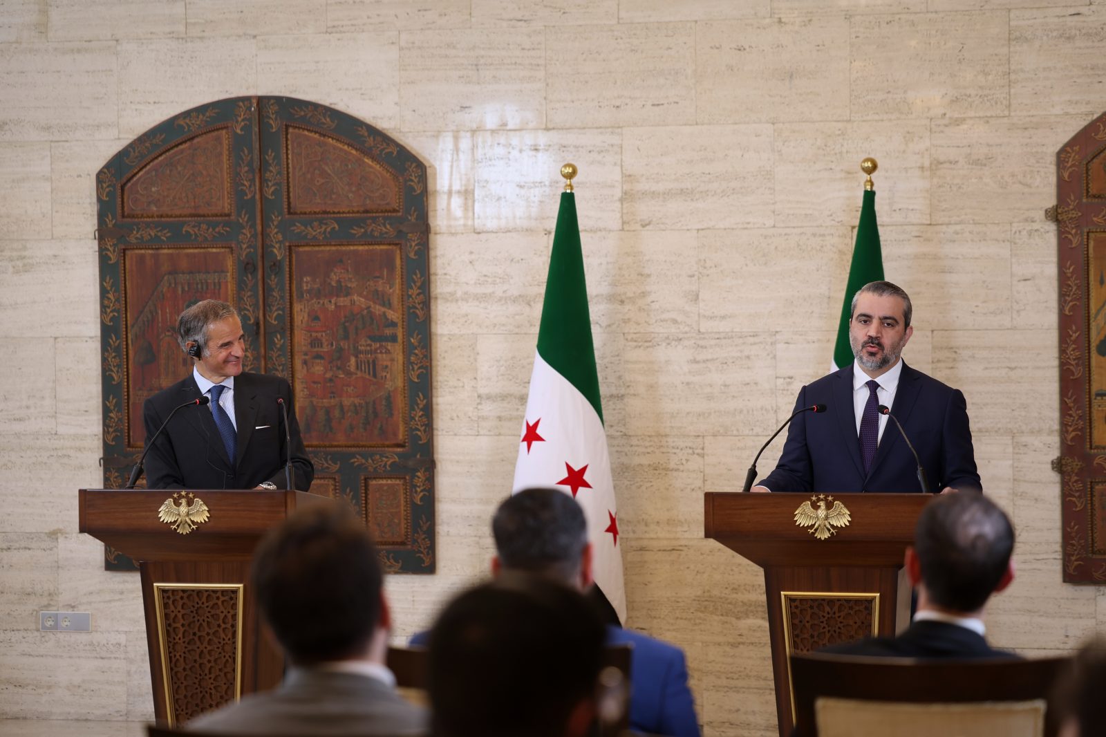 International Atomic Energy Agency's director-general Rafael Mariano Grossi, left, and Syrian Foreign Minister Asaad al-Shibani attend a press conference in Damascus, Syria, Tuesda