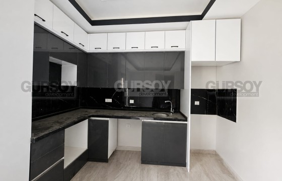 Квартира 1+1 в новом доме с выходом в сад в Авсалларе в Турции - фото 1
