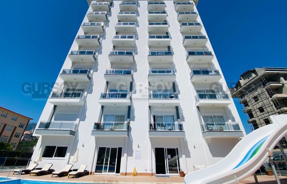 Меблированная квартира 1+1 с видом на горы в элитном ЖК в Махмутларе по выгодной цене, 65 м2 в Турции - фото 2