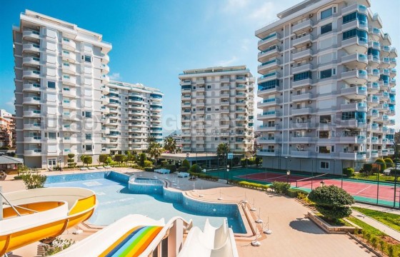 Квартира на первой береговой линии 3+1, общей площадью 130 м2 в районе Тосмур г. Алания в Турции - фото 1